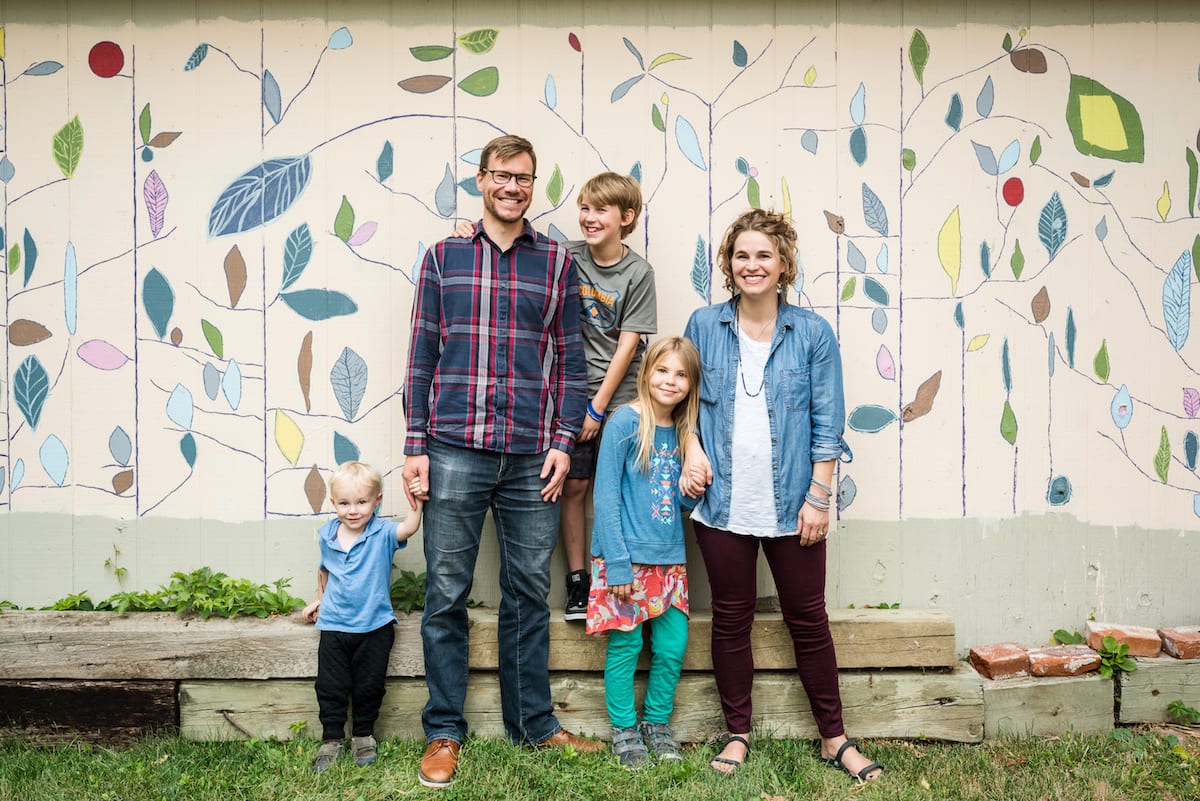 Family poses in front of mural | Family Photography | From the Hip Photo
