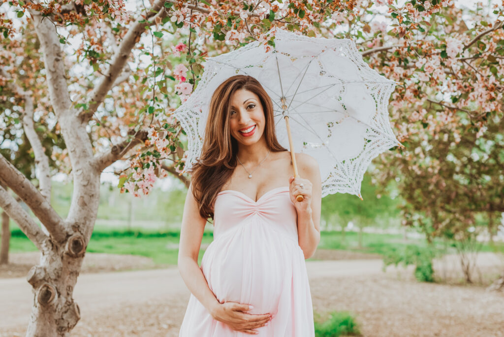 Hudson Gardens outdoor garden park floral plants candid fun loving maternity picture | From the Hip Photo Denver Colorado portrait photography