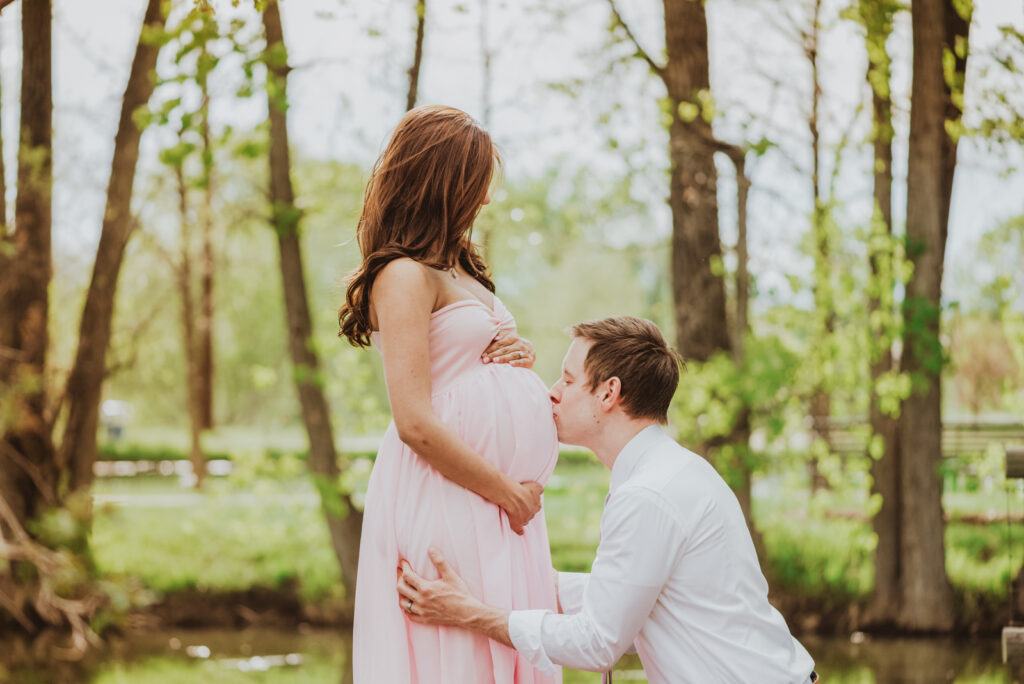Hudson Gardens outdoor garden park floral plants candid fun loving maternity picture | From the Hip Photo Denver Colorado portrait photography