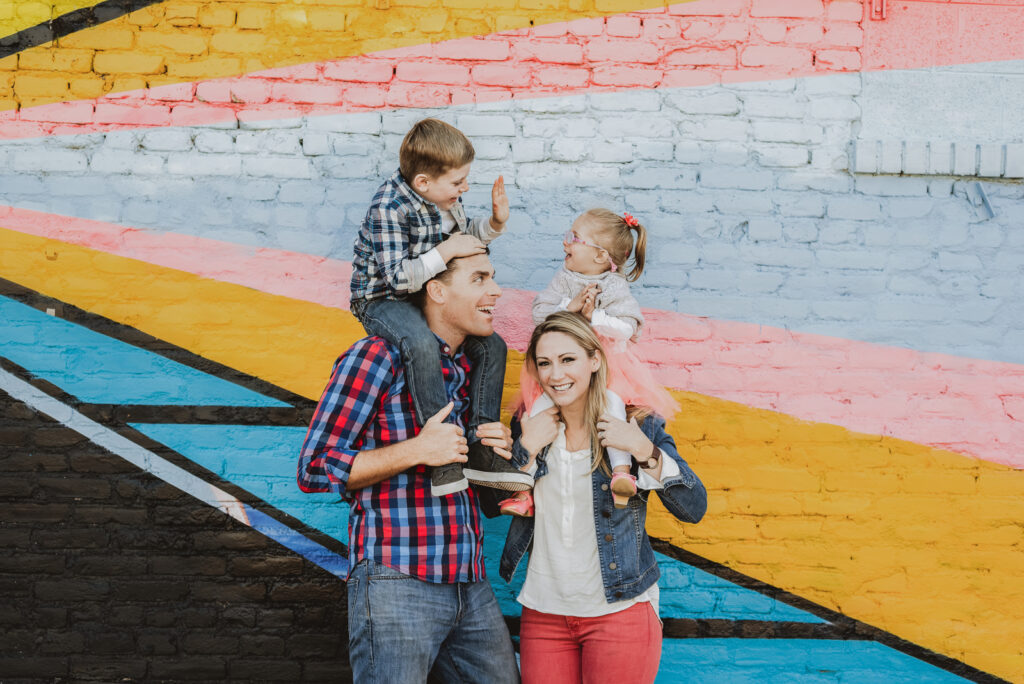 RiNo Art District Denver Colorado mural bold hippy fun candid colorful family picture | From the Hip Photo portrait photography 