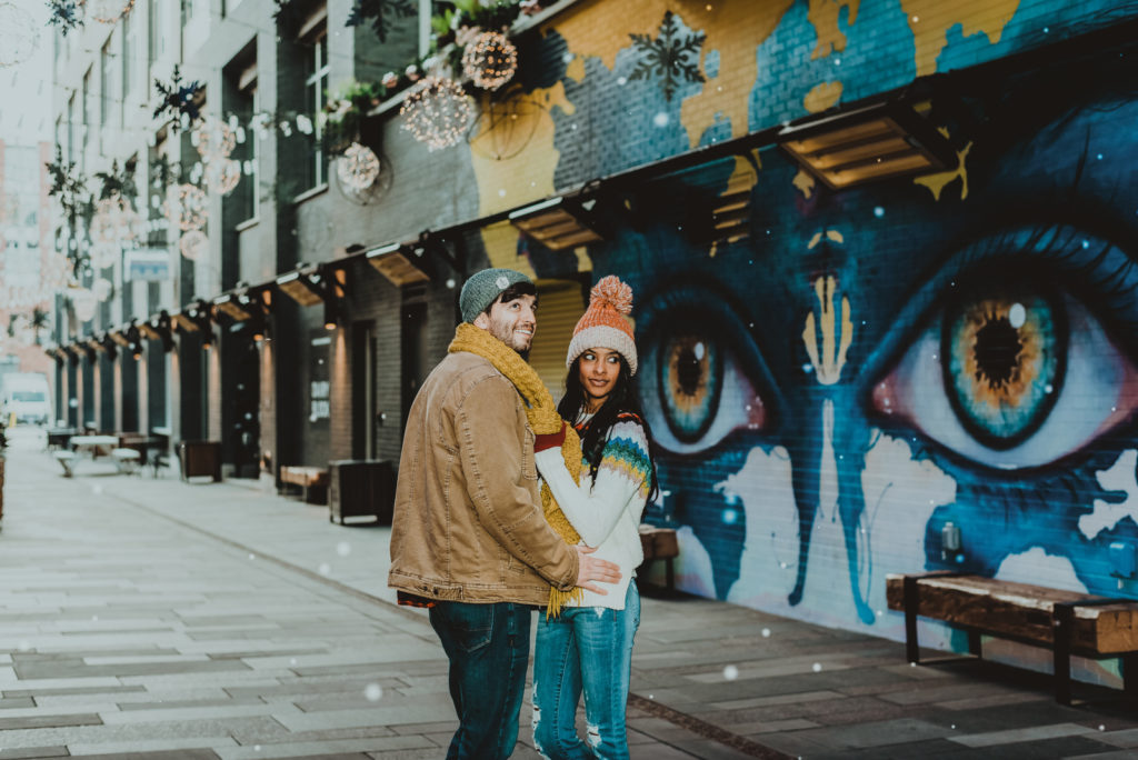 Downtown Denver Dairy Block outdoor urban fun candid loving engagement picture | From the Hip Photo Denver portrait photography