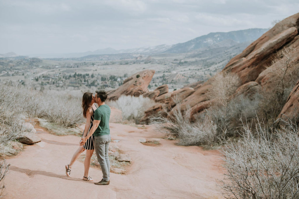 Red Rocks, Colorado | Outdoors mountain view | Couple kissing | Engagement photos