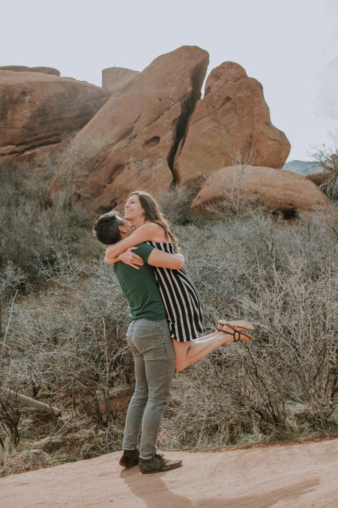Red Rocks, Colorado | Outdoors | Couple embracing | Engagement photos