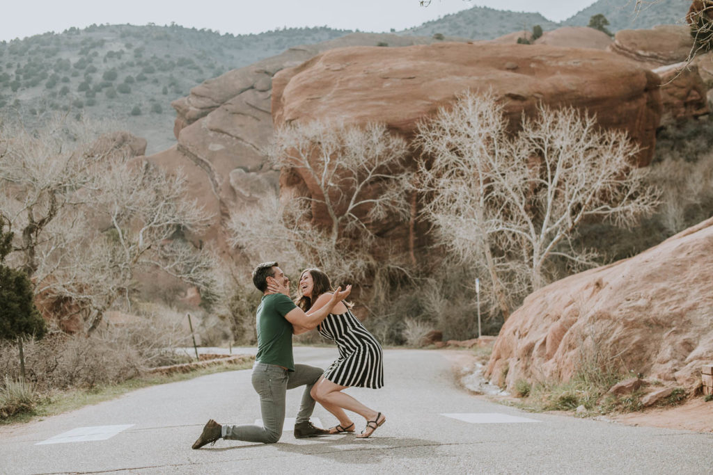 Red Rocks, Colorado | Outdoors | Couple embrace | Engagement photos