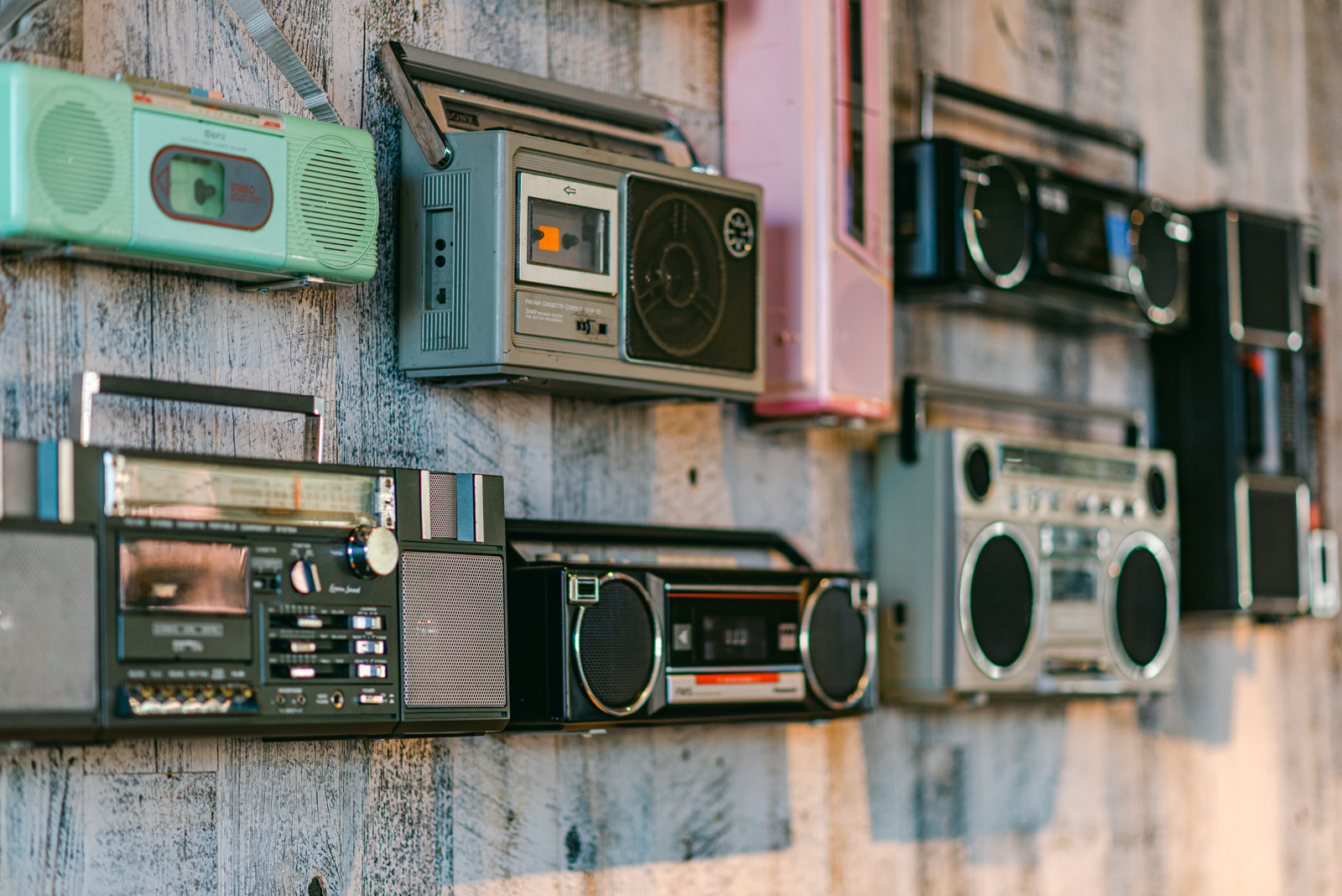 West to East Coast with Hello Betty | Product photos | A wall covered in differently shaped radios | Bethesda, MD | Oceanside, CA
