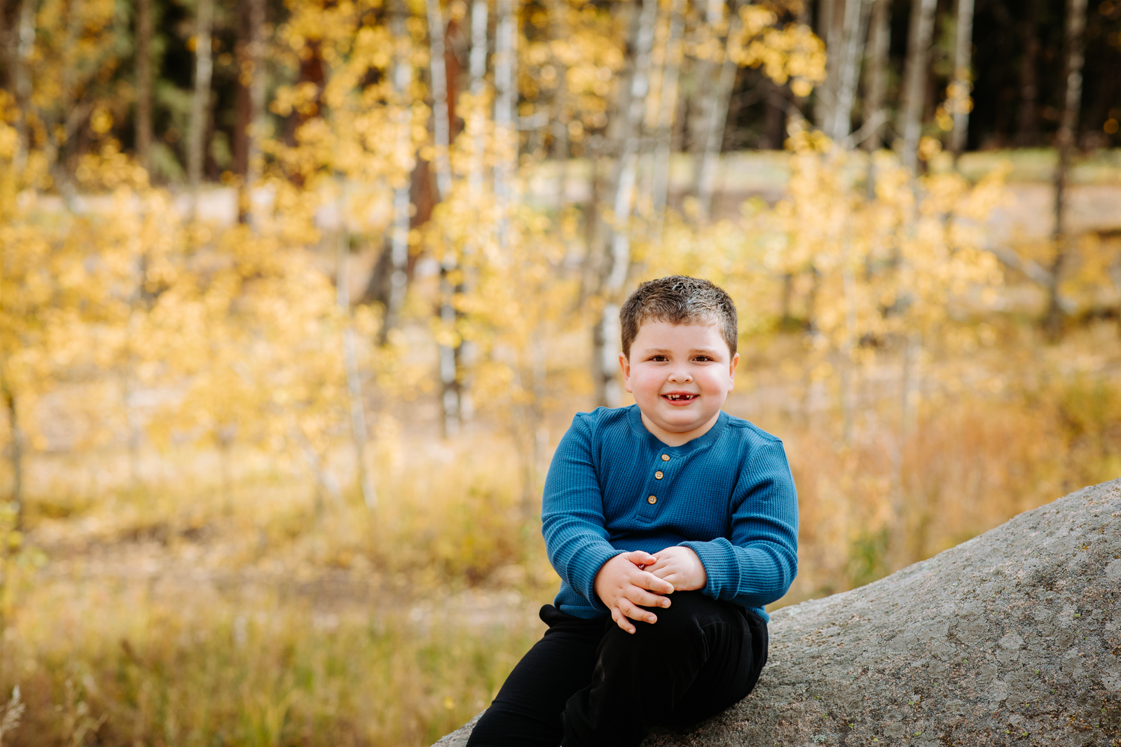 little boy posing during family photos at Meyer Ranch Park