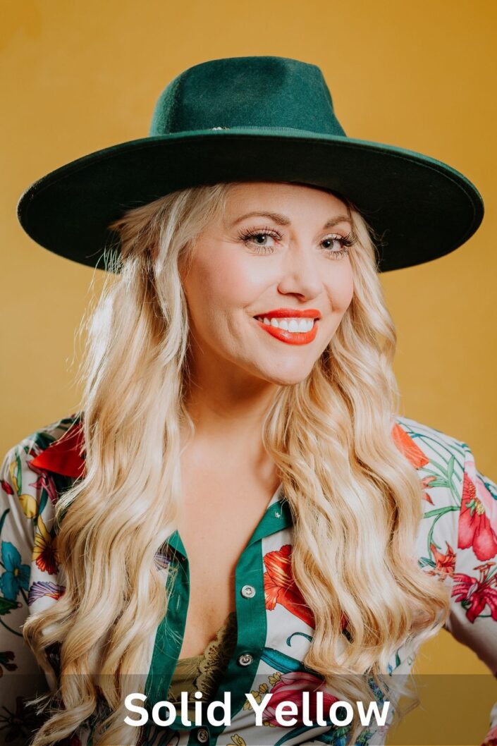 Professional portrait on Solid Yellow backdrop — Denver studio photography by From the Hip Photo