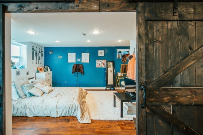 Rustic Bedroom with Barn Door Photo | Colorado Real Estate Photographer
