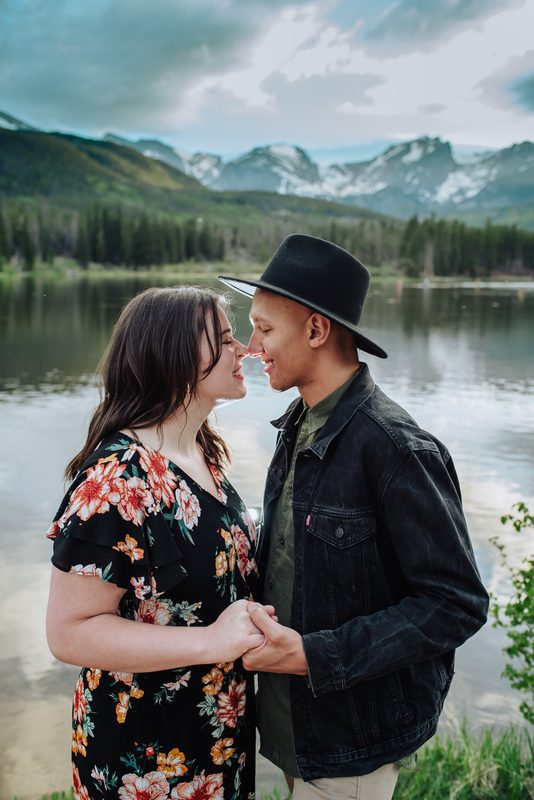 Couple at Lost Gulch Overlook during Denver engagement photo session with mountain views