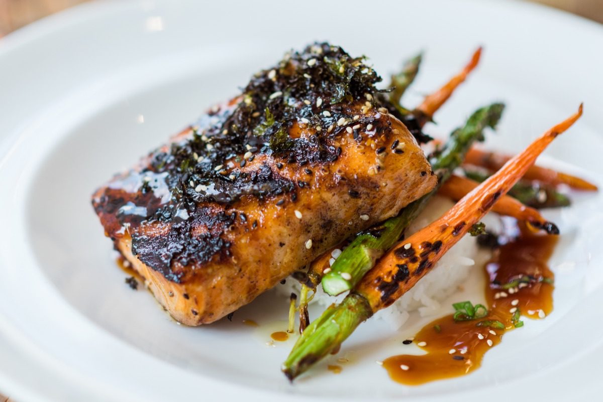 Denver food photographer documents chef plating technique in restaurant kitchen