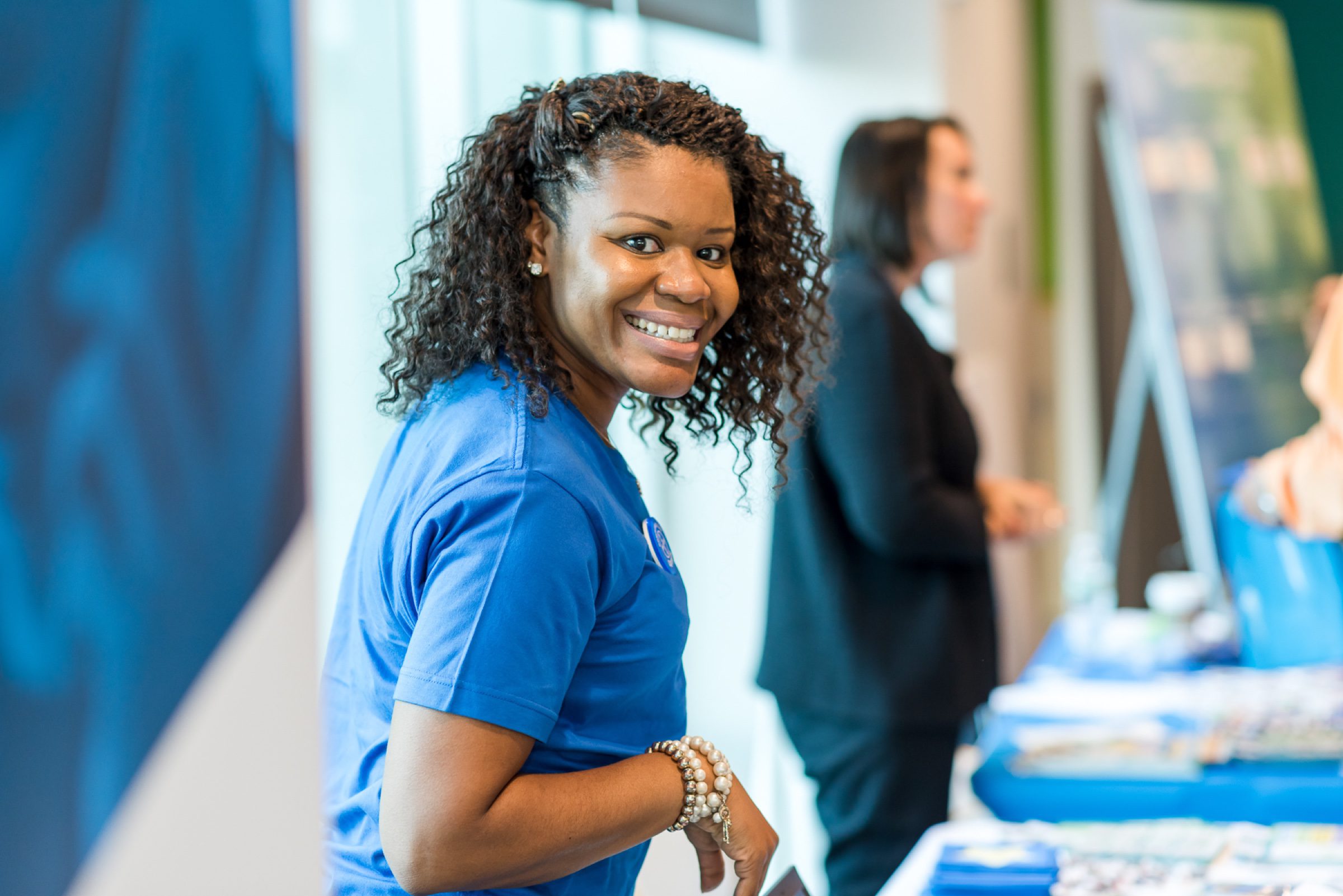 Registration + arrival -- warm staff welcome at the check-in table