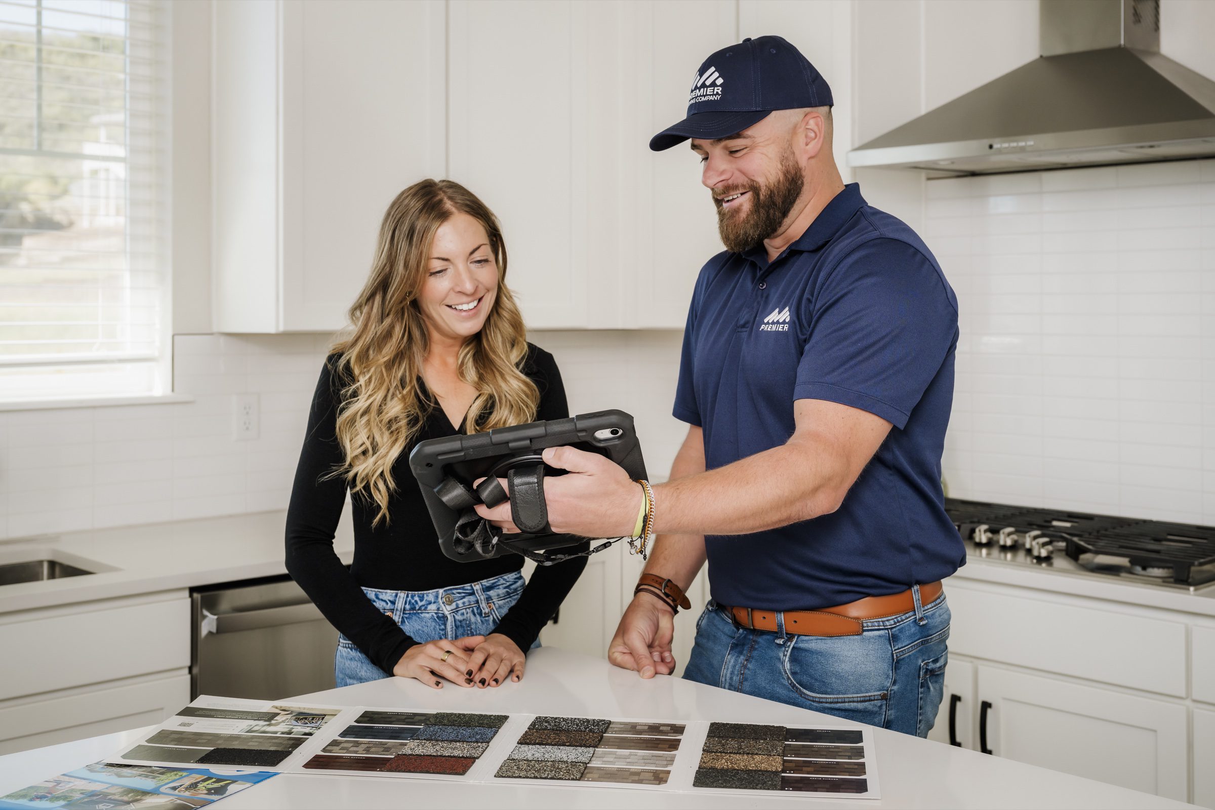 Sales rep + customer reviewing material samples in-home
