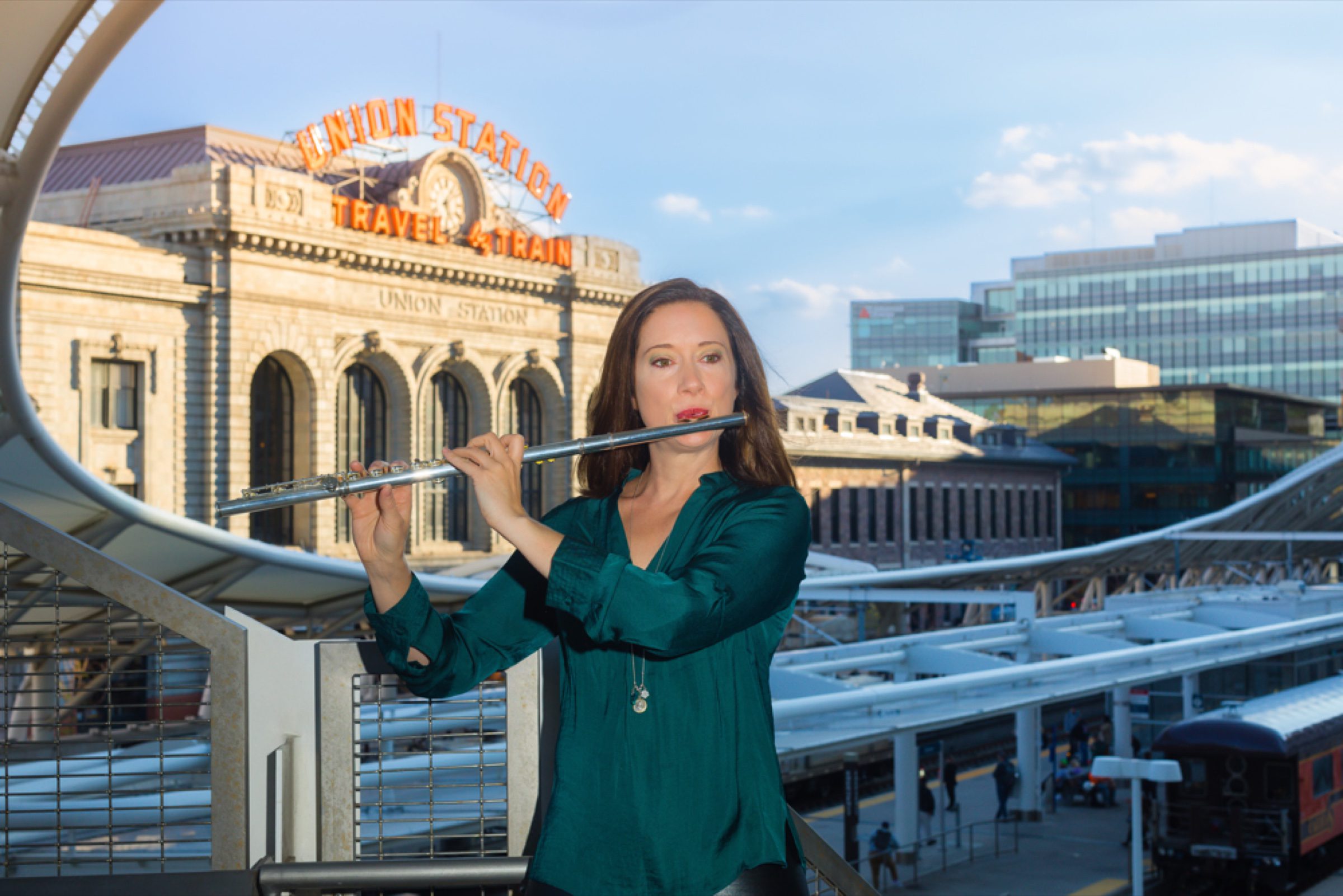 Flutist on the Union Station plaza in golden hour light