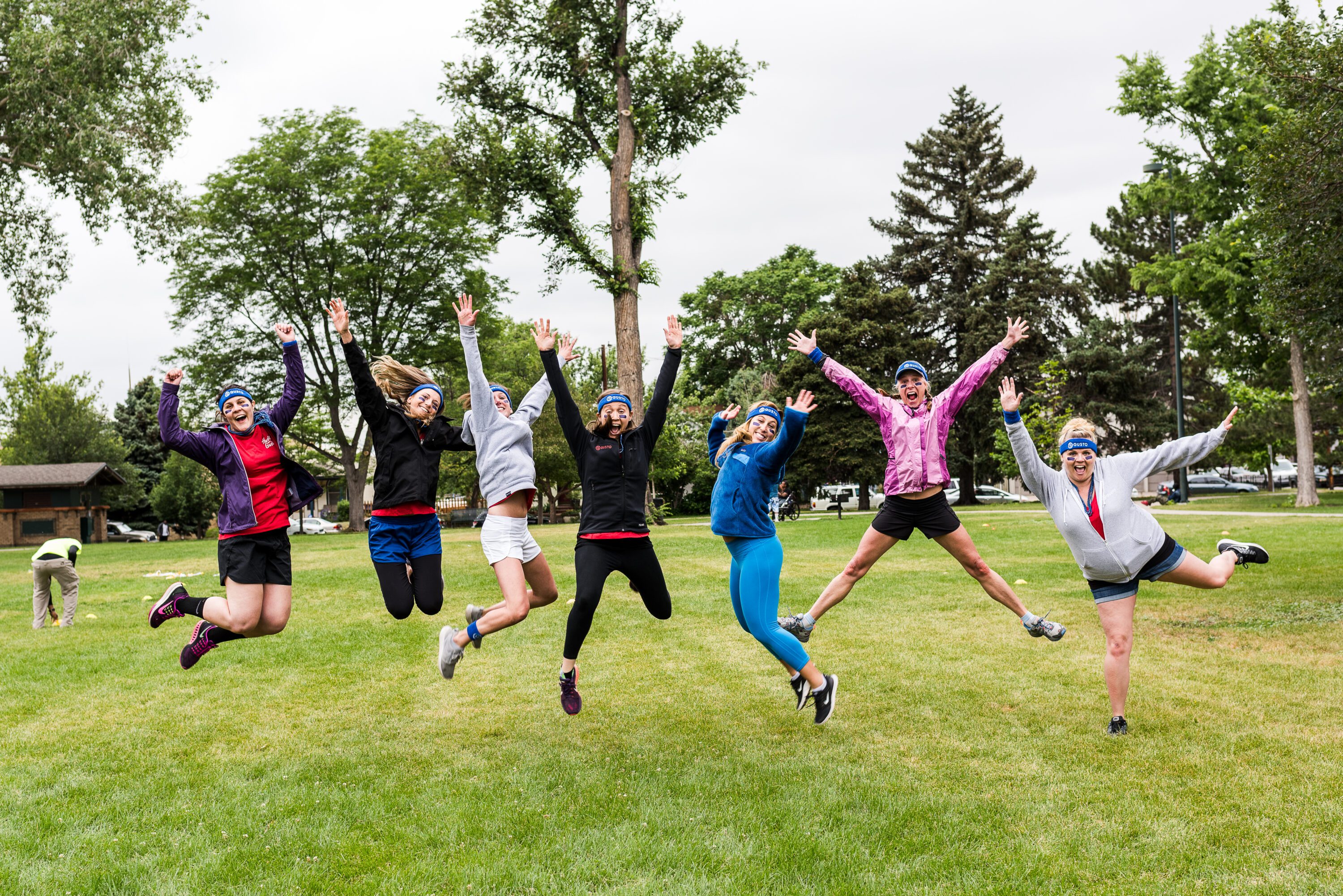 Team jumping for joy at corporate field day