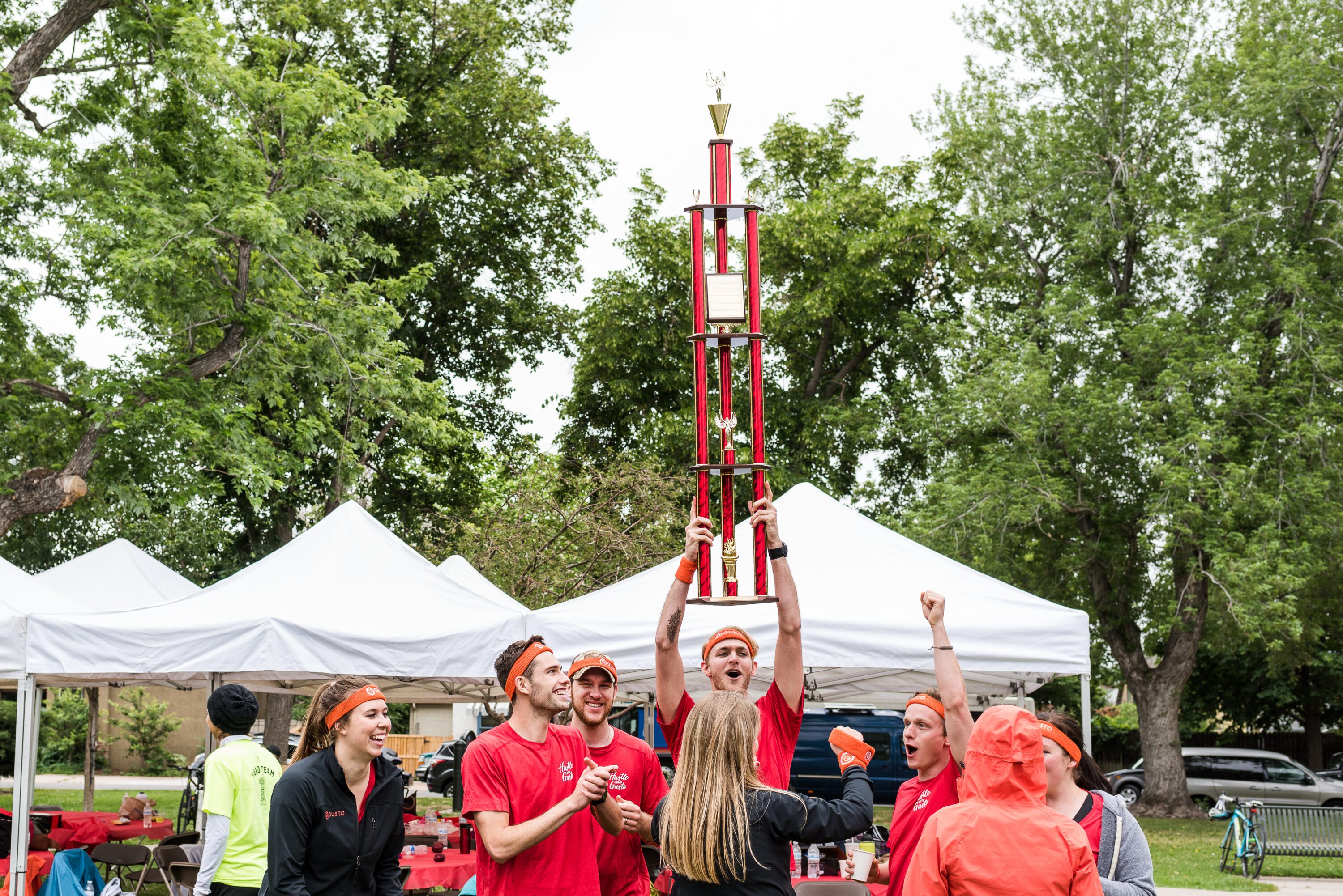 Team celebrating victory with trophy