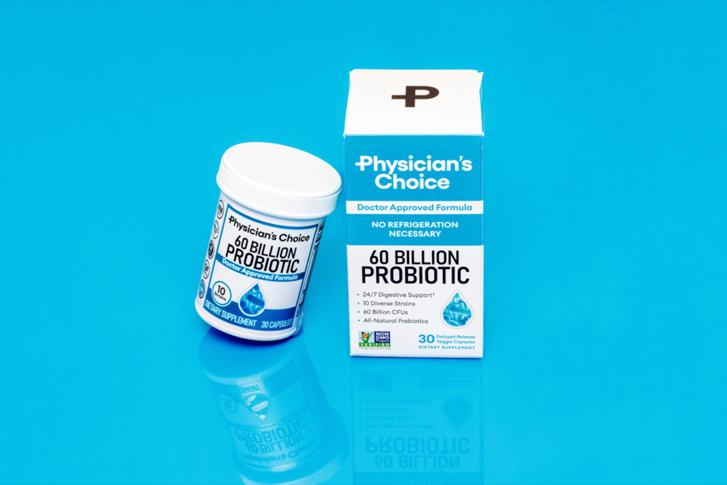 Box and bottle on saturated blue seamless with subtle reflection -- styled brand frame for social