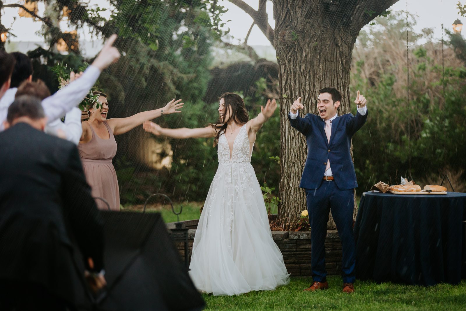 Guests cheering the newlyweds outdoors at an Arrowhead Golf Club wedding
