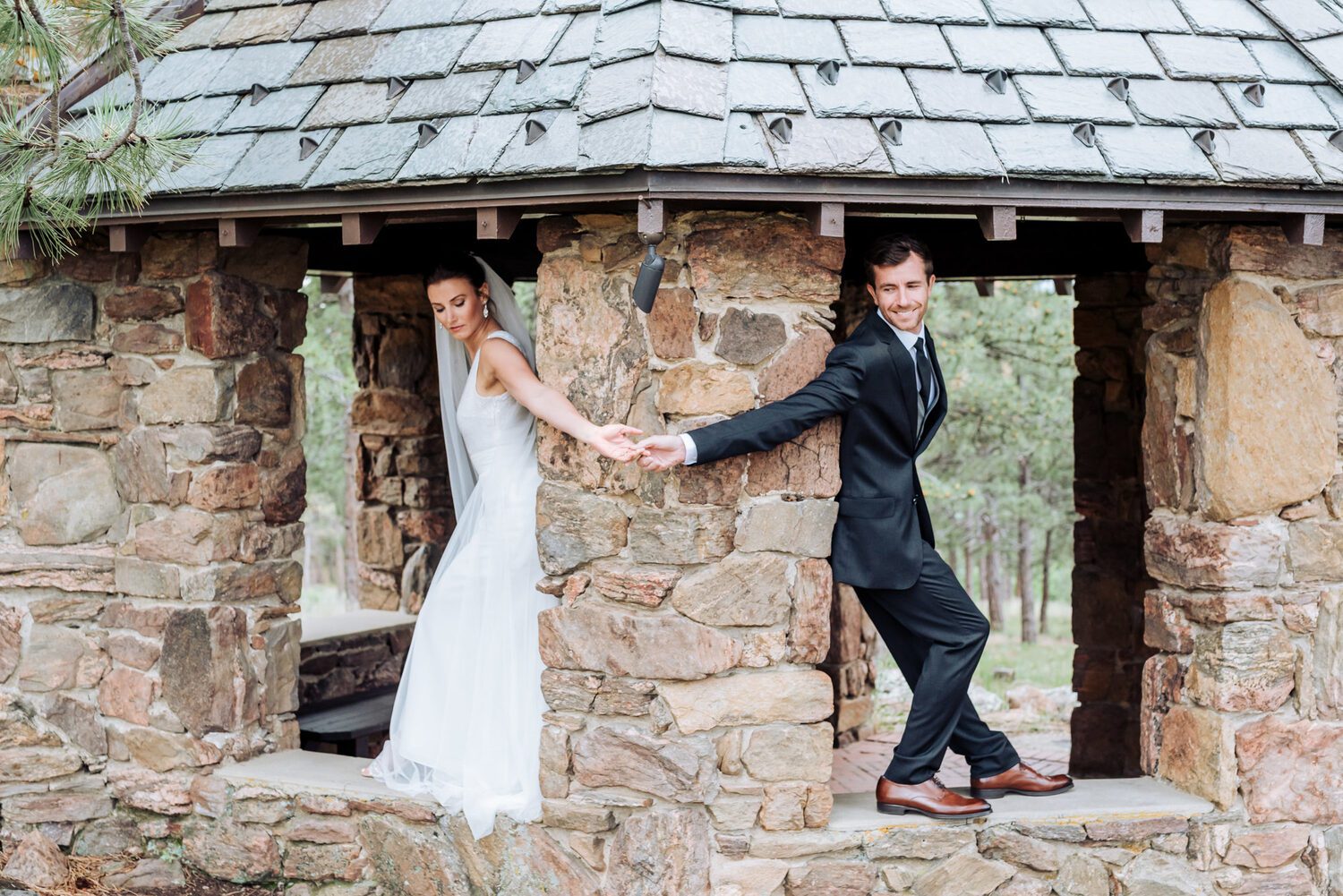 Couple in the stone pavilion on the Boettcher Mansion grounds