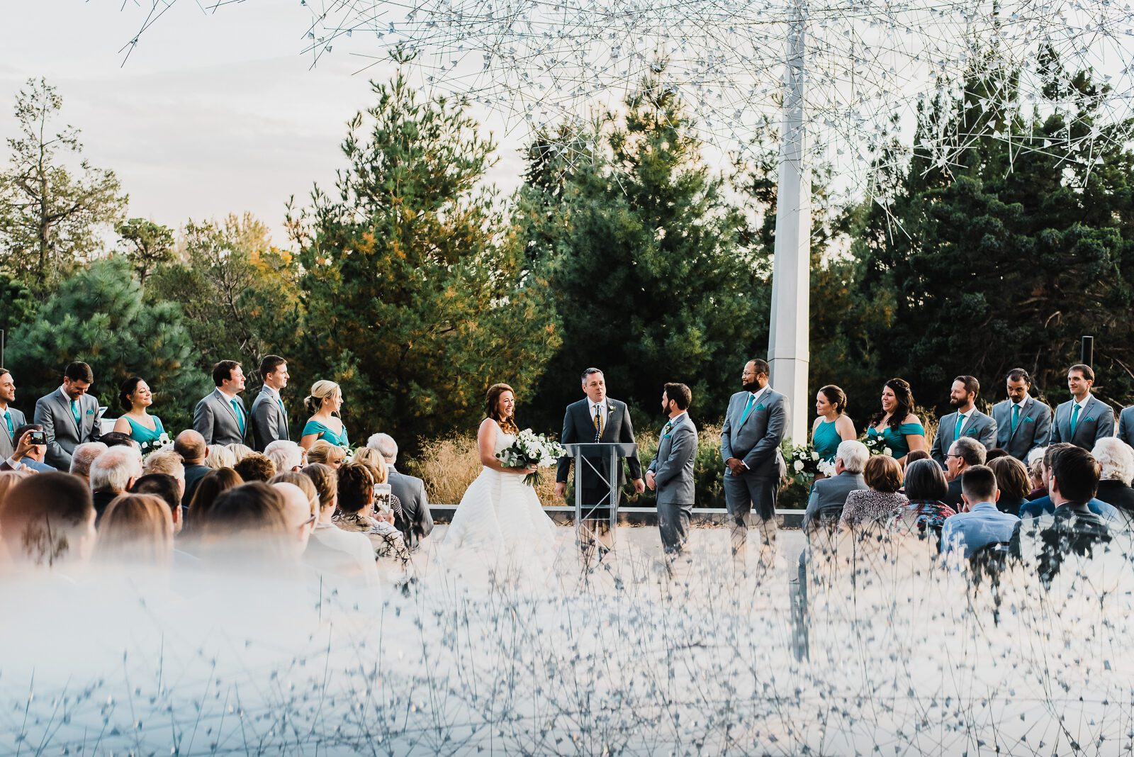 Outdoor wedding ceremony on the terrace at the Denver Museum of Nature and Science