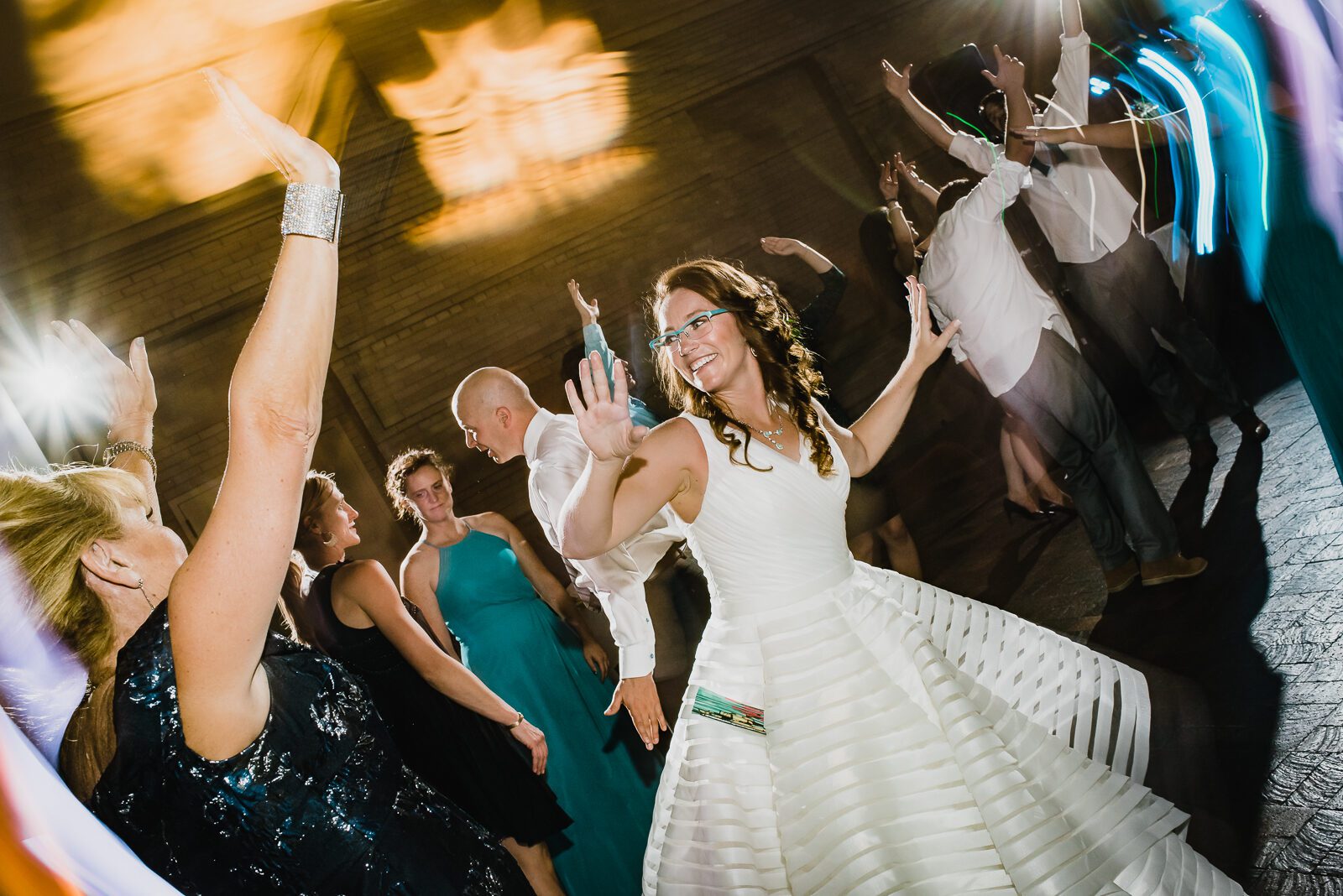 Guests dancing at a Denver Museum of Nature and Science wedding reception