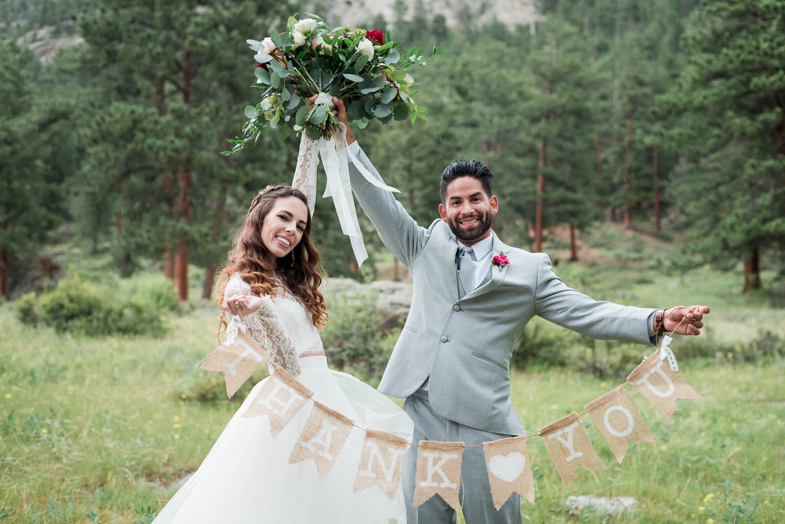 Newlyweds celebrating in the meadow at Della Terra Mountain Chateau