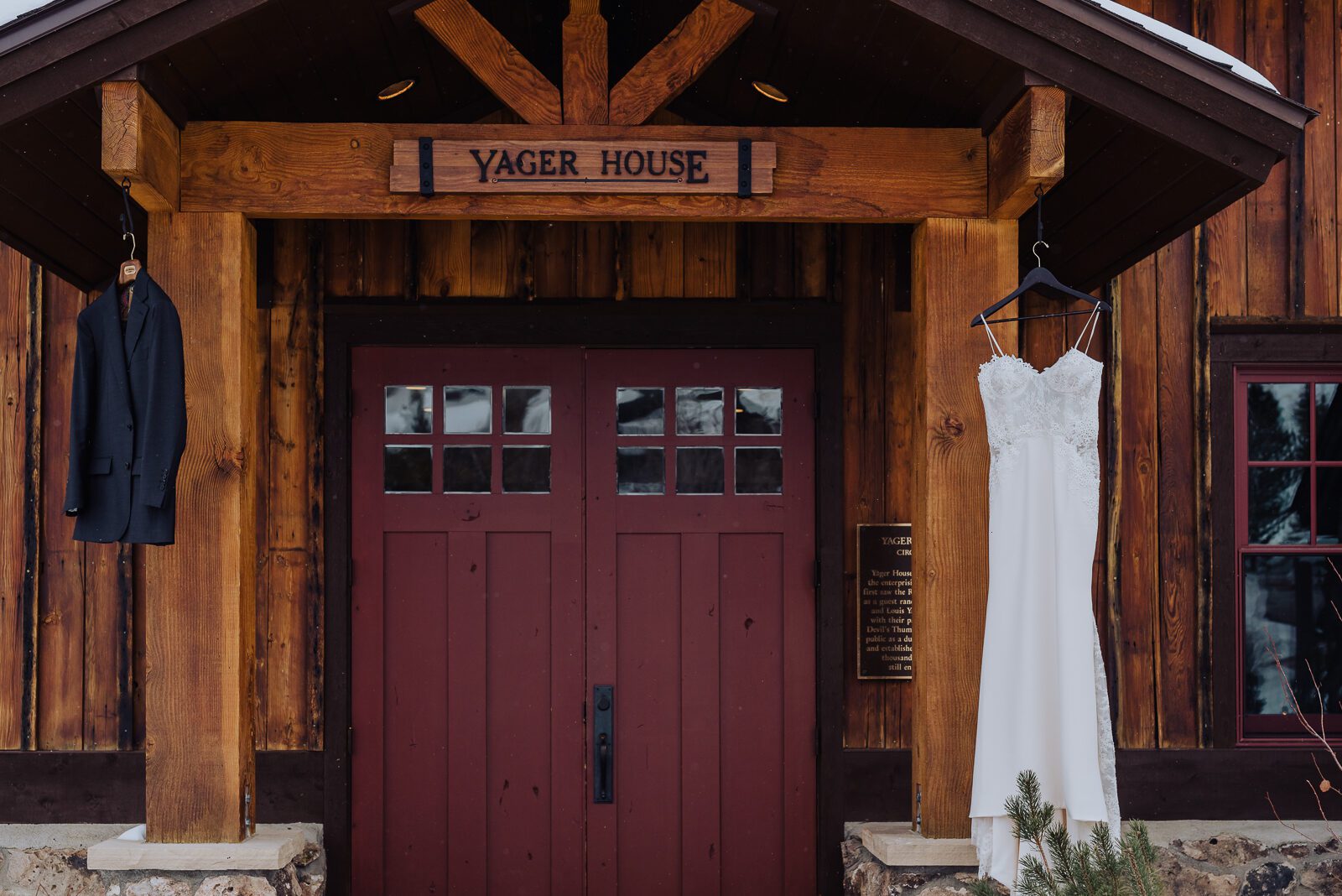 The wedding dress hanging at the Yager House doors at Devil's Thumb Ranch