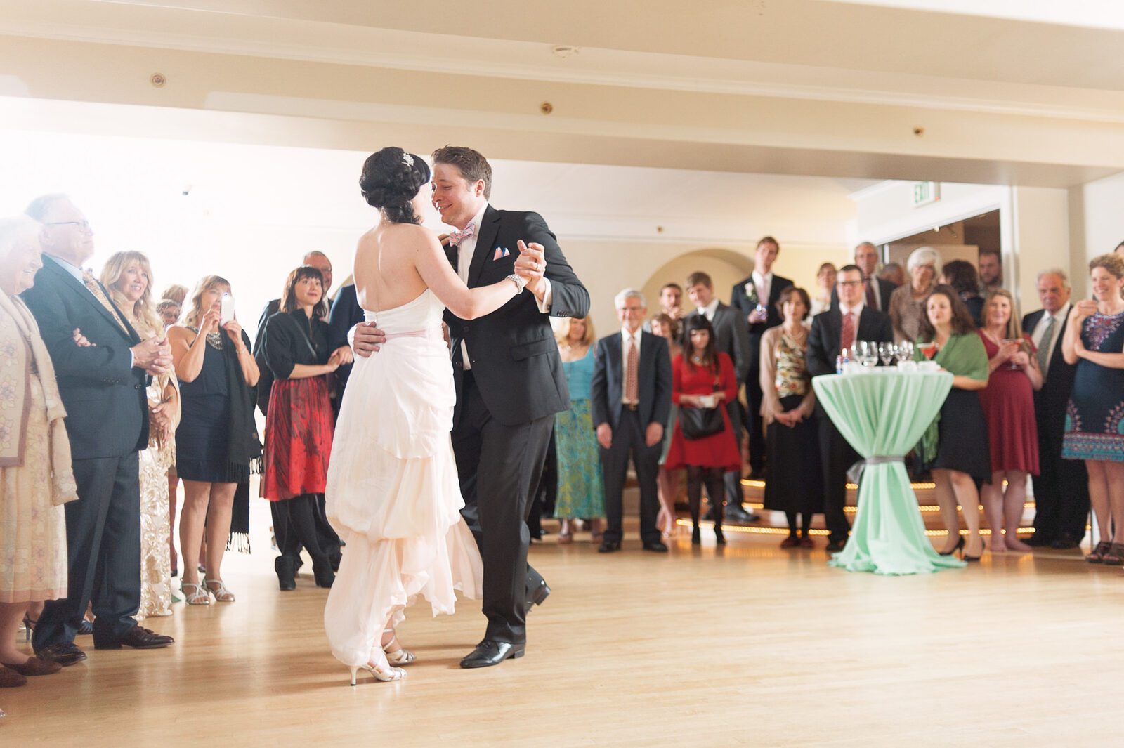 First dance in the ballroom at the Grant-Humphreys Mansion, guests circled around