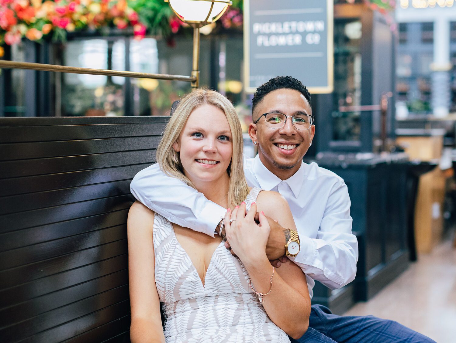 Couple beside the flower shop in Denver Union Station
