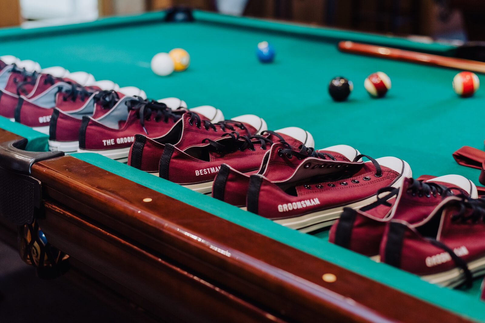 Bowling shoes lined up along the billiards table at the Denver Athletic Club